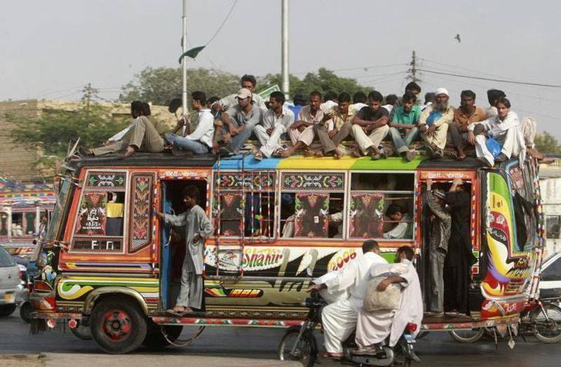 File - People travel on a bus in Pakistan's business city of Karachi, on September 17, 2008. Photo: Reuters