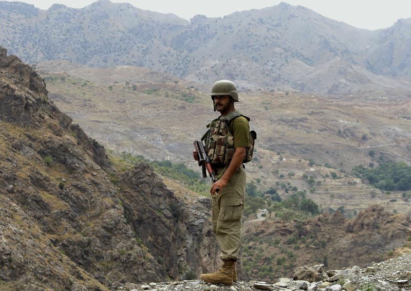 FILE - In this June 15, 2016 file photo, a Pakistani army soldier stands guard in Pakistani tribal area of Khyber, near Torkham border post between Pakistan and Afghanistan. Photo: AP