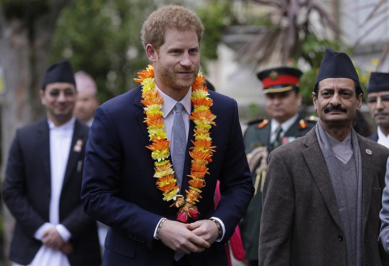 Prince Harry (left) with Nepal's Minister for Industry Nabindra Raj Joshi, at the Embassy of Nepal in London, on Monday, March 20, 2017. Photo: AP