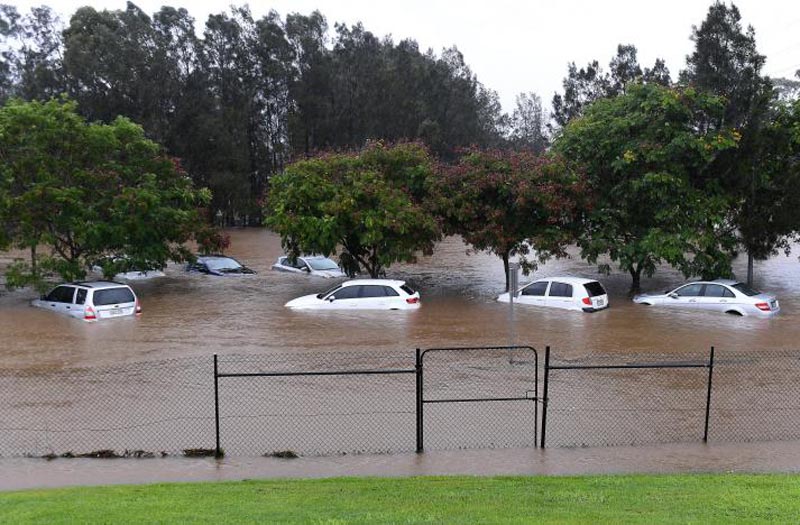 Cars sit submerged after heavy rain associated with Cyclone Debbie hit the Gold Coast suburb of Robina in Queensland, Australia, March 30, 2017.  Photo: Reuters
