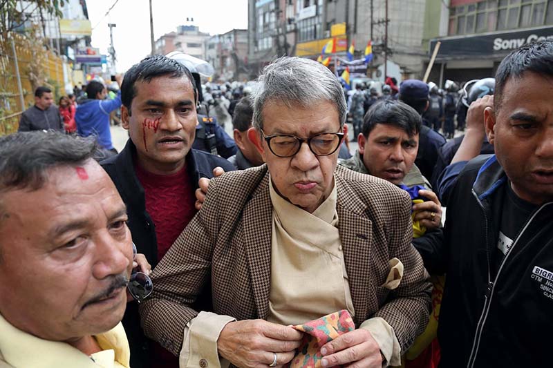 Rastriya Prajantantra Party leader Pashupati Shumsher Rana with injured RPP cadres after a clash erupted between them and police outside the Election Commission in Kathmandu, on Monday, March 20, 2017. Photo: RSS