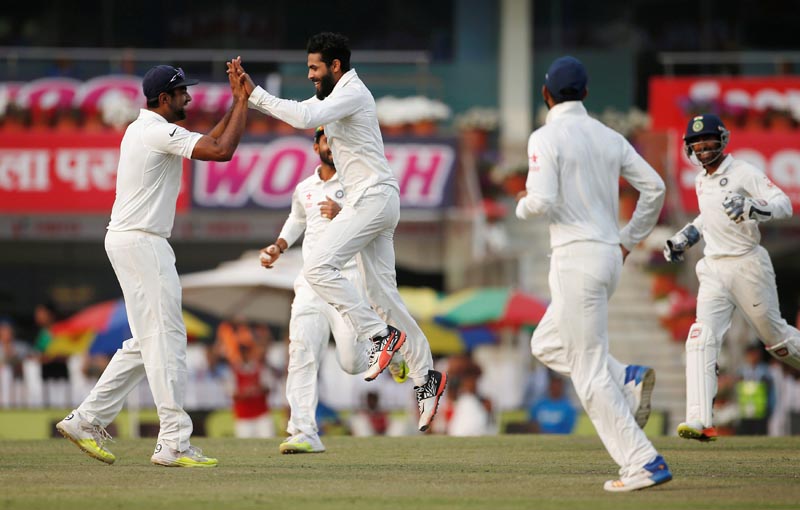 India's Ravindra Jadeja (2nd L) celebrates with his teammates after dismissing Australia's Nathan Lyon. Photo: Reuters