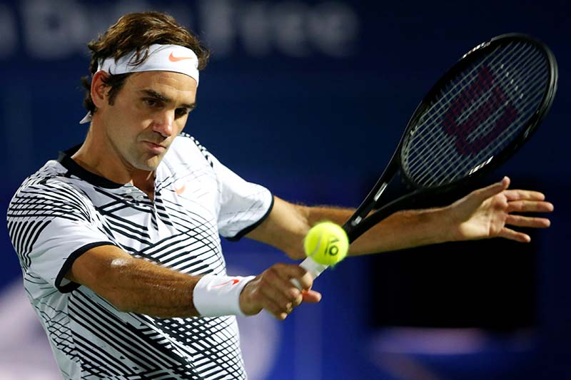 Roger Federer of Switzerland serves against Evgeny Donskoy of Russia in Men's Singles Dubai Open in Dubai, UAE on Wednesday, March 1, 2017. Photo: Reuters