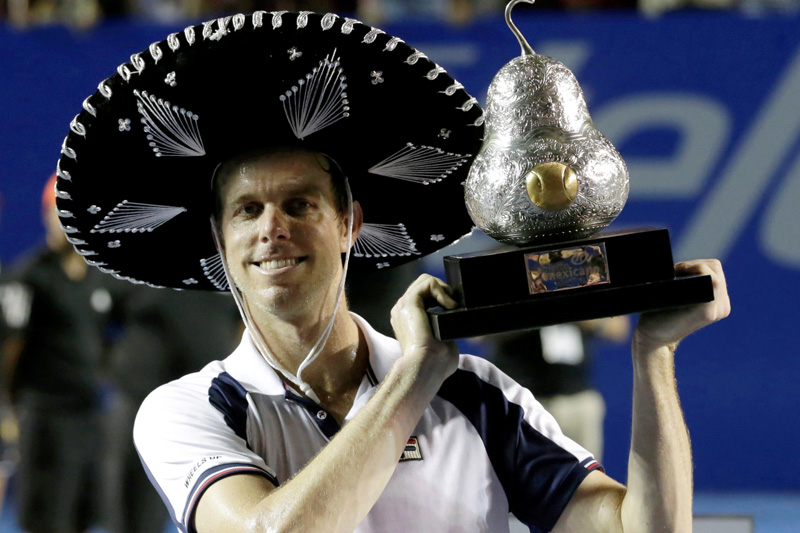 USA's Sam Querrey holds up the trophy after winning his final match against Spain's Rafael Nadal. Photo: Reuters
