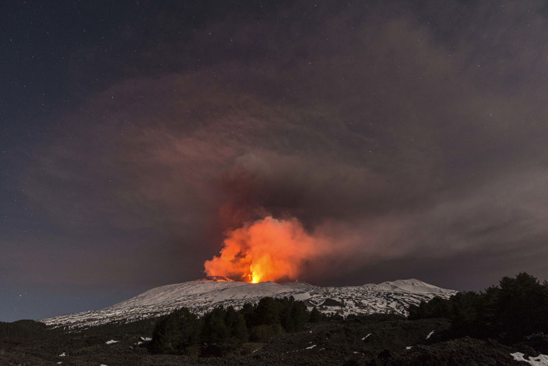 Snow-covered Mount Etna, Europe's most active volcano, spews lava during an eruption in the early hours of Thursday, March 16, 2017. A new eruption which began on March 15 is causing no damages to Catania's airport which is fully operational. Photo: AP
