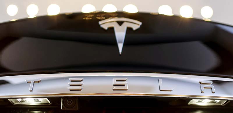 A Tesla logo adorns a 'Model S' car in the dealership in Berlin, Germany, on November 18, 2015. Photo: Reuters/File