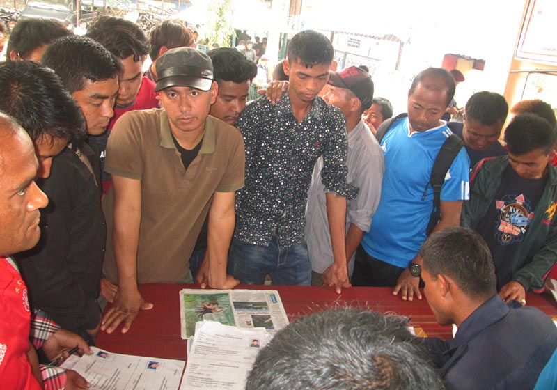 Youths gathering to submit forms for temporary police posts on the last day for submission, in District Police Office, Tanahun, on Thursday, March 30, 2017. Photo: THT