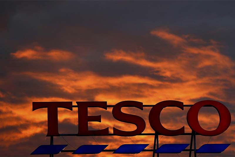 A company logo is pictured outside a Tesco  supermarket in Altrincham northern England, on April 16, 2016. Photo: Reuters