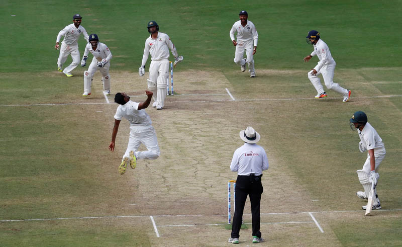 India's Ravichandran Ashwin (3rd L) celebrates with teammates after winning the match. Photo: Reuters