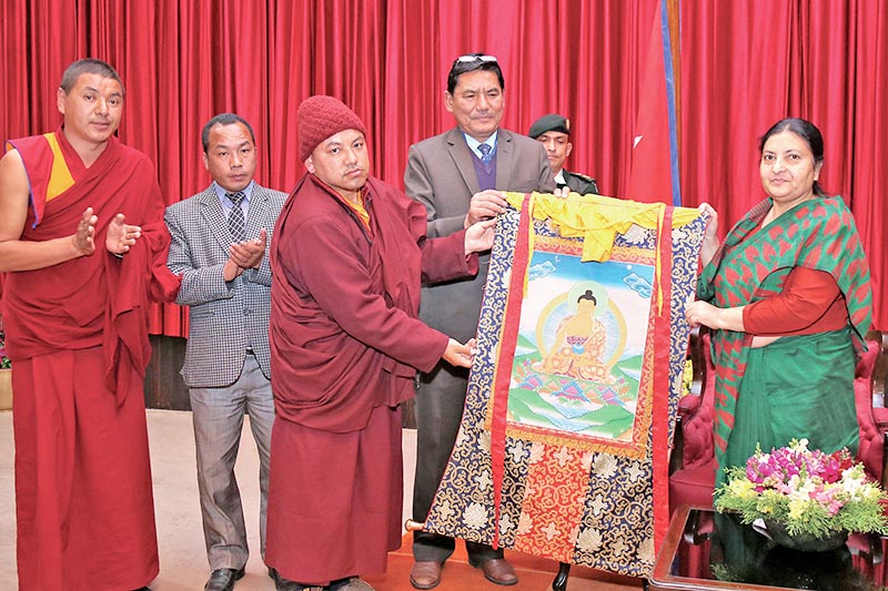 Lama teachers presenting a thangka painting to President Bidya Devi Bhandari, in Kathmandu, on Tuesday, March 21, 2017. Photo: RSS