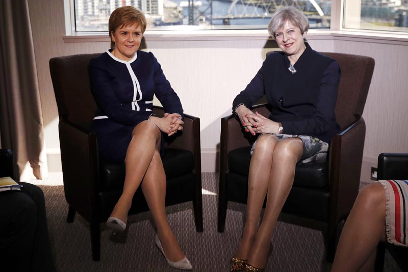 Britain's Prime Minister Theresa May, right,  and  Scotland's First Minister Nicola Sturgeon sit during their meeting in Glasgow, Scotland, Monday March 27, 2017. Photo: AP
