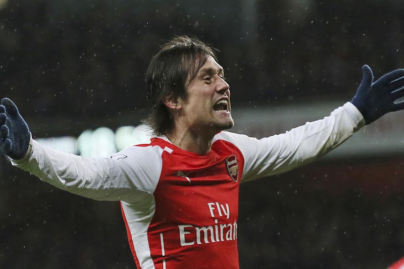 FILE - A Friday, Dec. 26, 2014 file photo of Arsenal's Tomas Rosicky celebrating after scoring a goal during the English Premier League soccer match between Arsenal and Queens Park Rangers at the Emirates Stadium, London. Photo: AP