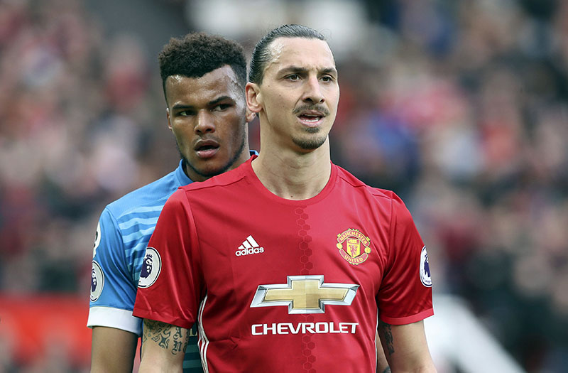 AFC Bournemouth's Tyrone Mings (left) and Manchester United's Zlatan Ibrahimovic during the English Premier League soccer match at Old Trafford, Manchester, England, on Saturday, March 4, 2017. Photo: Martin Rickett/PA via AP