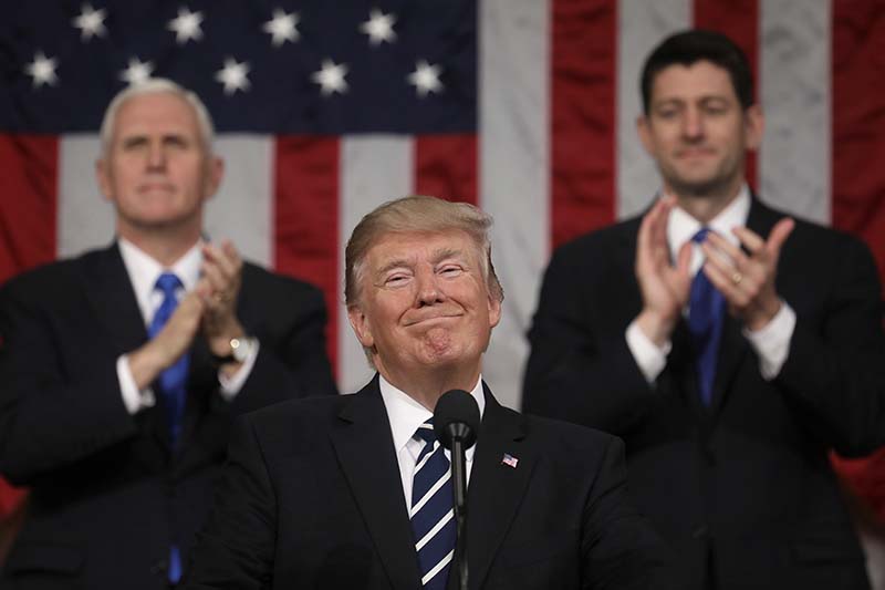 US President Donald Trump addresses a joint session of Congress on Capitol Hill in Washington, on Tuesday, February 28, 2017, as Vice President Mike Pence and House Speaker Paul Ryan of Wisconsin applaud. Photo: AP