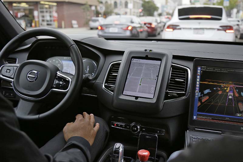 File-An Uber car in driverless mode waits in traffic during a test drive in San Francisco on Tuesday, December 13, 2016. Photo: AP