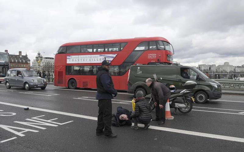 A man lies injured after a shooting incident on Westminster Bridge in London, March 22, 2017. Photo: Reuters