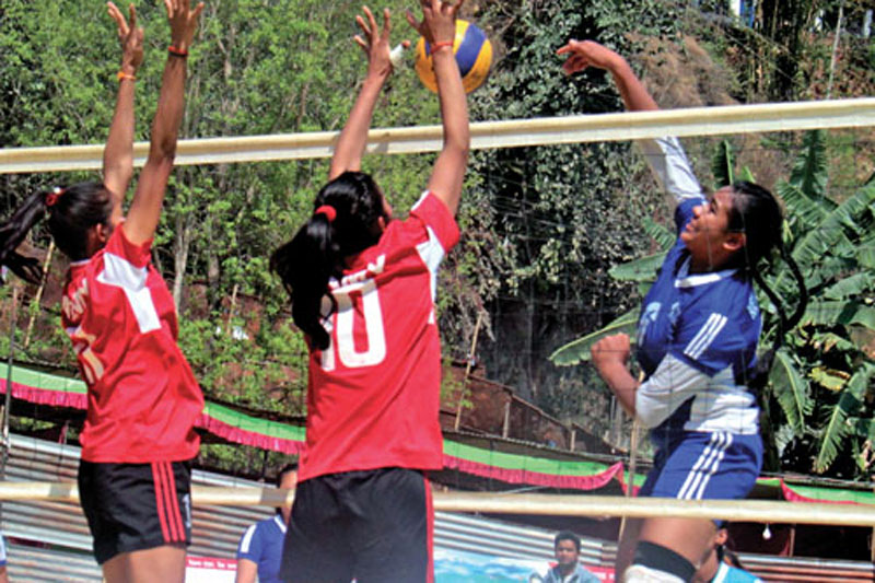 Pratibha Mali (right) of New Diamond goes up for a spike against TAC during their group-stage match of the first Didibahini Cup Womenu0092s Volleyball Tournament in Parbat on Thursday, March 9, 2017. Photo: THT