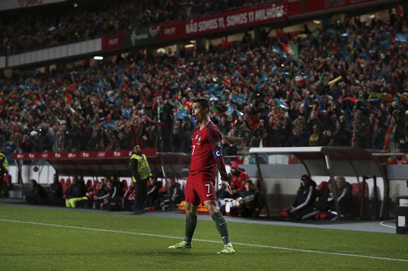 Portugal's Cristiano Ronaldo celebrates after scoring a goal during the World Cup Group B qualifying soccer match between Portugal and Hungary at the Luz stadium in Lisbon, on Saturday, March 25 2017. Photo: AP