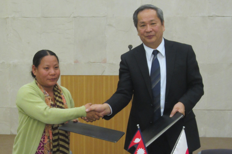 Japanese Ambassador to Nepal Masashi Ogawa and NESPEC President Ganga Rai exchange an agreement to implement the Project for the Construction of Training Center for Womenu0092s Cooperatives in Udayapur district, in Kathmandu, on Friday, March 3, 2017. Photo: Japanese Embassy