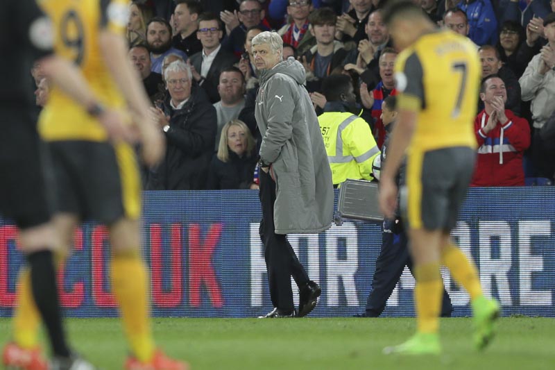 Arsenal manager Arsene Wenger looks back across the pitch as he leaves after losing the English Premier League soccer match between Crystal Palace and Arsenal at Selhurst Park in London, on Monday April 10, 2017. Photo: AP