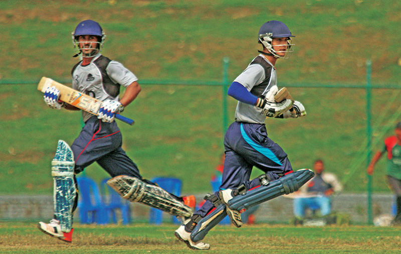 DAVu2019s Dhiraj Adhikari (left) and teammate Jitendra Singh Thakuri run between the wickets during their nSuper Eight Cricket Tournament match against VM Warriors at the TU Stadium in Kathmandu on Friday, March 31, 2017. Photo: Udipt Singh Chhetry/ THT