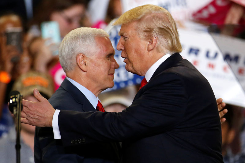 US Vice President Mike Pence (left) and US President Donald Trump appear on stage at a rally in Harrisburg, Pennsylvania, US on April 29, 2017. Photo: Reuters