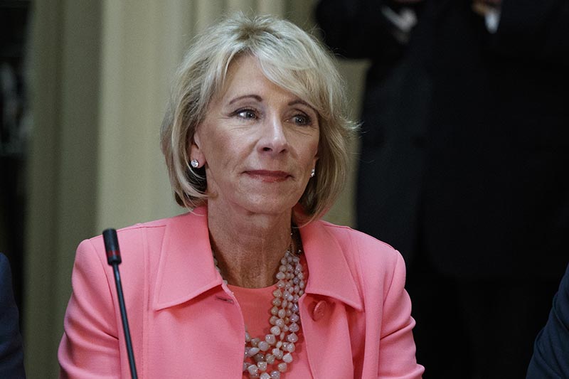 FILE - Education Secretary Betsy DeVos is seen in the State Department Library of the Eisenhower Executive Office Building on the White House complex in Washington, on April 11, 2017. Photo: AP