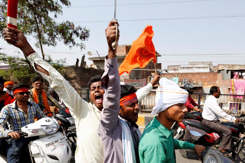 Hindu Yuva Vahini vigilante members take part in a rally in the city of Unnao, India, April 5, 2017. Picture taken on April 5, 2017. Photo: Reuters