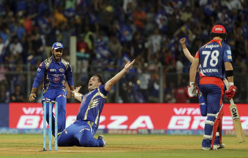Mumbai Indians Mitchell McClenaghan (centre), celebrates after Corey Anderson's wicket during their Indian Premier League (IPL) cricket match against Delhi Daredevils in Mumbai, India, on Saturday, April 22, 2017. Photo: AP