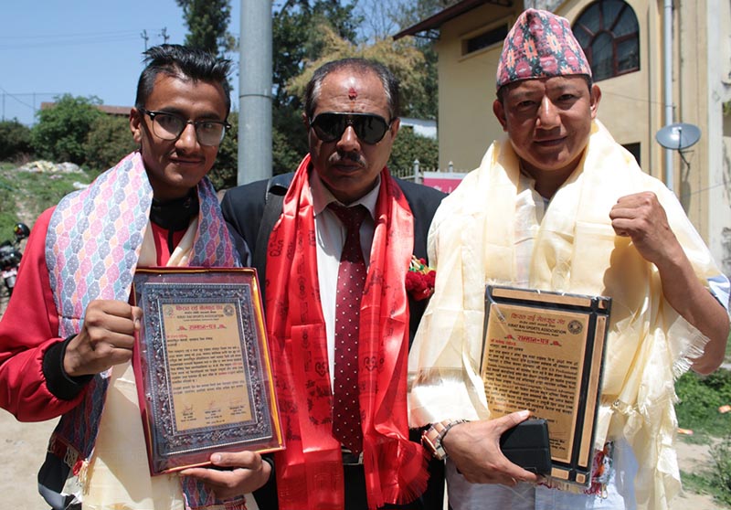 Sanjay Rai (left) and Magendra Rai (right) with NSC Administration Department chief Suresh Dhungana after a felicitation programme in Kathmandu, on Thursday, April 6, 2017. Photo: THT