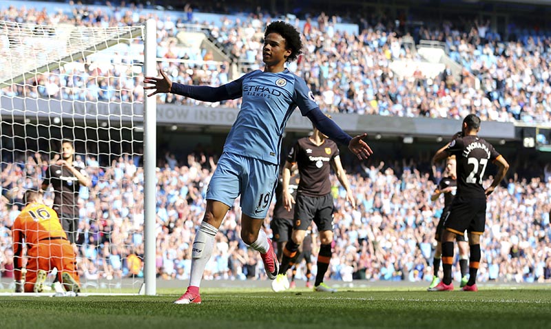 Manchester City's Leroy Sane, center, celebrates after an own goal from Hull City's Ahmed Elmohamady, right, during their English Premier League match at the Etihad Stadium, Manchester, England, Saturday, April 8, 2017. Photo: Dave Thompson/PA via AP