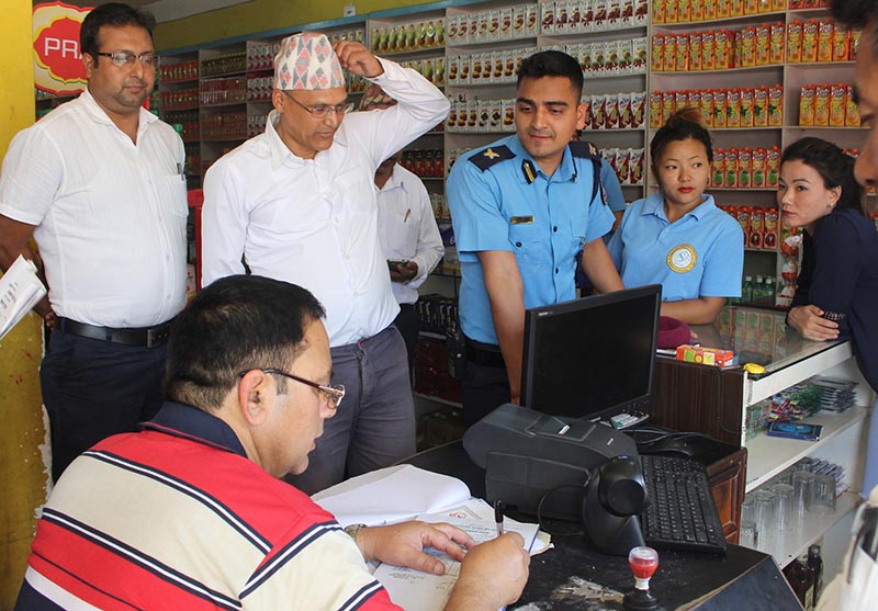 A market monitoring team inspecting a liquor shop in Gaighat, Udayapur, on Thursday, April 27, 2017. Photo: THT