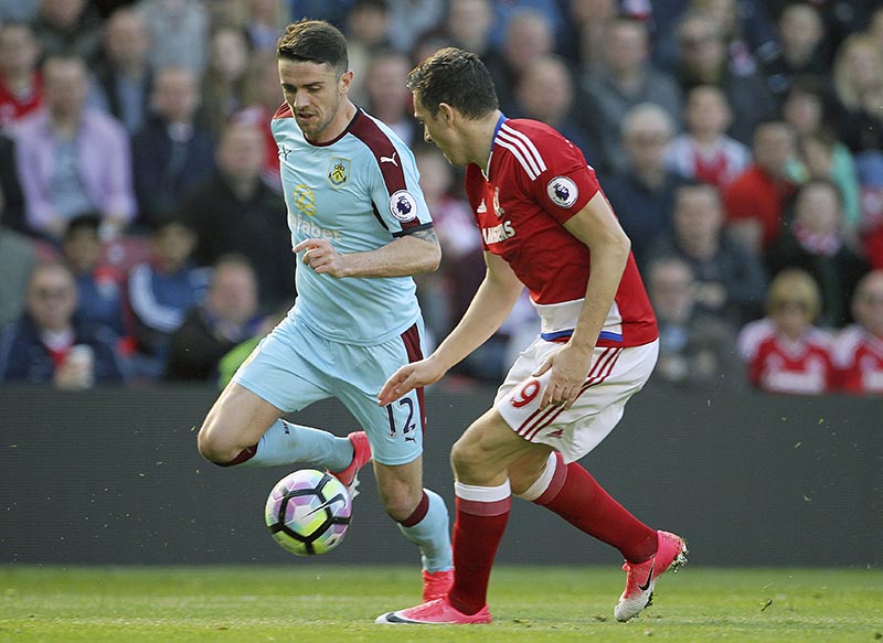 Burnley's Robbie Brady, left, and Middlesbrough's Stewart Downing in action during their English Premier League soccer match at the Riverside Stadium in Middlesbrough, England, Saturday April 8, 2017. (Richard Sellers/PA via AP)