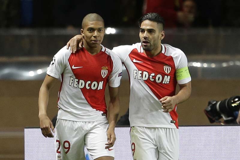 Monaco's Radamel Falcao (right), celebrates his team's second goal with Monaco's Kylian Mbappe during the Champions League quarterfinal second leg soccer match between Monaco and Dortmund at the Louis II stadium in Monaco, on Wednesday April 19, 2017. Photo: AP