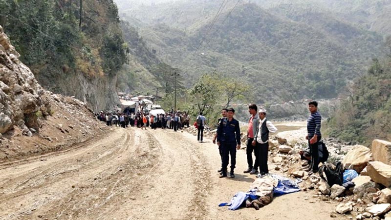 FILE: Passengers are stranded after a dry landslide obstructed the Muglin-Narayangadh road section, on Monday, April 3, 2017. Photo: Tilak Ram Rimal
