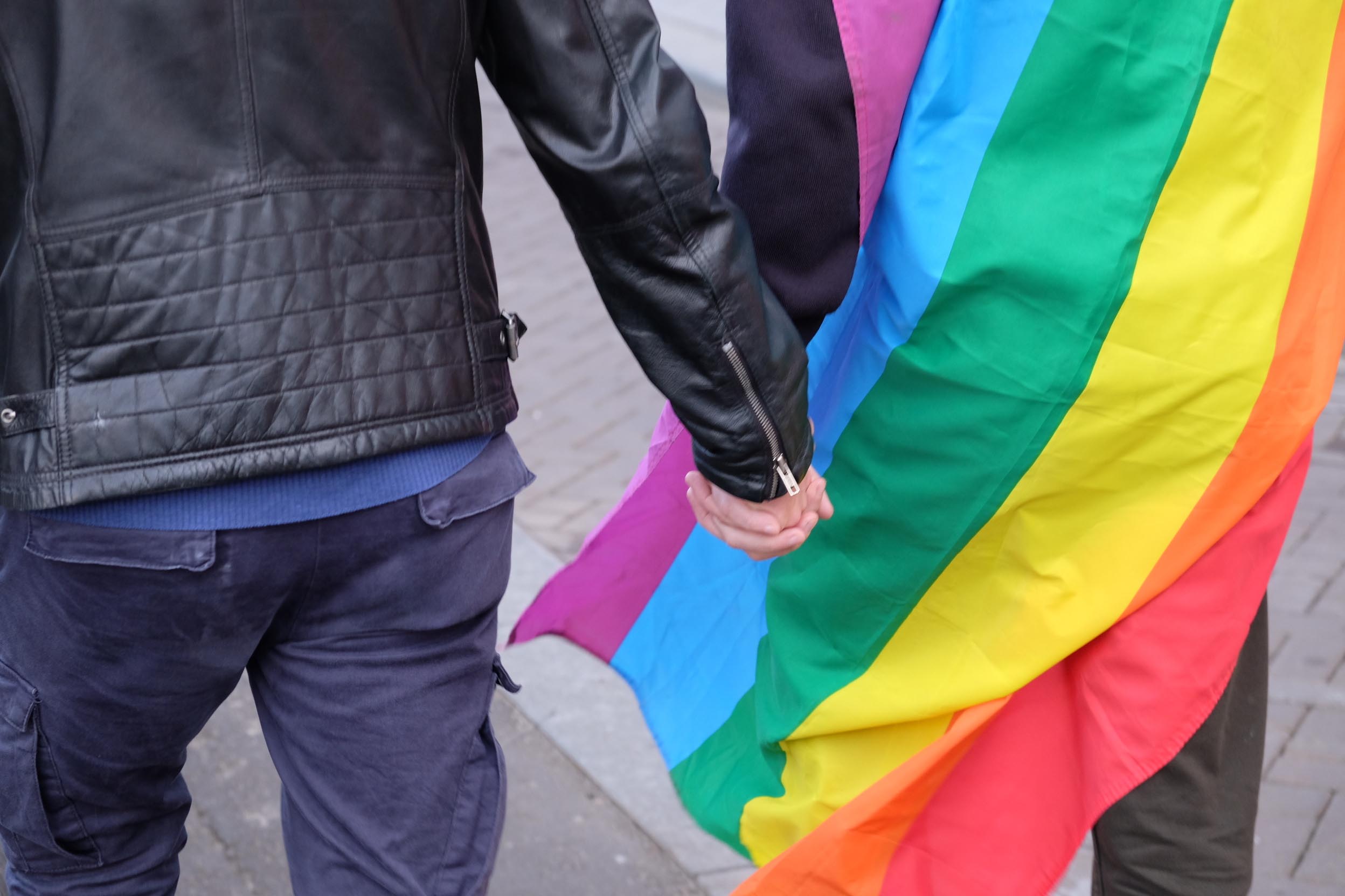 A couple hold hands as protesters march through the Dutch capital Amsterdam to show solidarity for two gay men who were badly beaten over the weekend in the eastern city of Arnhem, on Wednesday, April 5, 2017. Photo: AP
