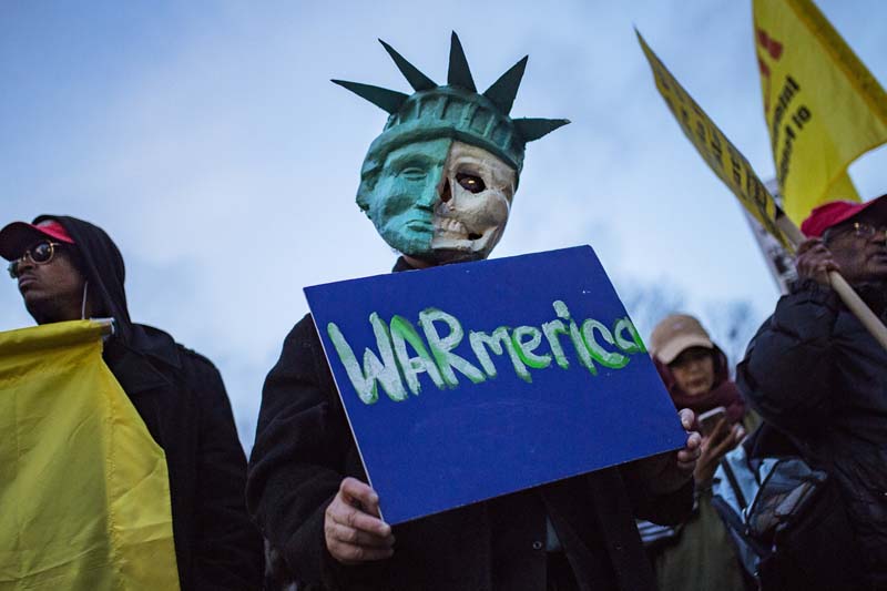 Protesters gather during a rally against the US missile strikes in Syria, in New York, on Friday, April 7, 2017. Photo: AP