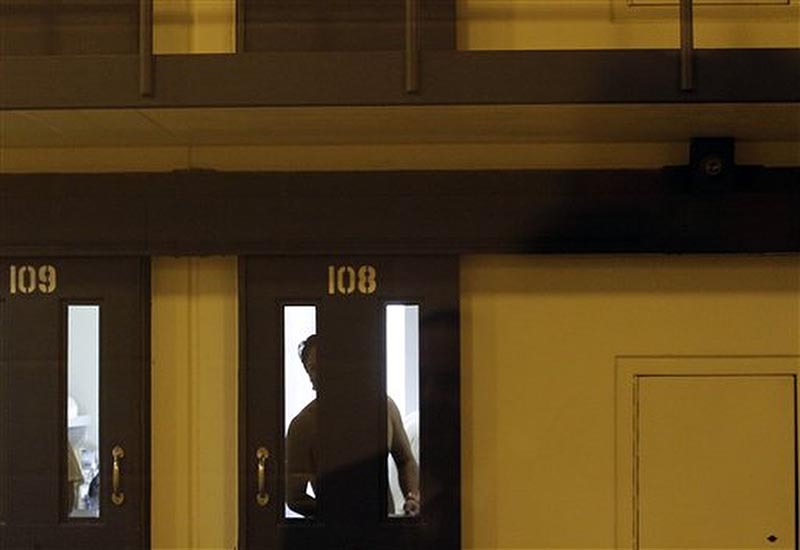 FILE - A man detained at the Otay Mesa immigration detention center looks out from a room in San Diego, on May 26, 2010. Photo: AP