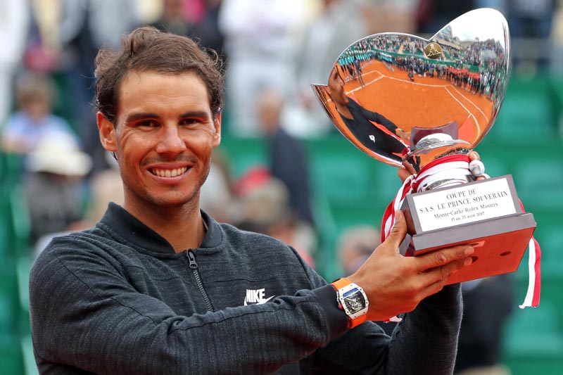 Rafael Nadal of Spain poses with his trophy after winning his final tennis match against his compatriot Albert Ramos-Vinolas at the Monte Carlo Masters. Photo: Reuters