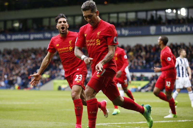 Liverpool's Roberto Firmino celebrates scoring their first goal. Photo: Reuters