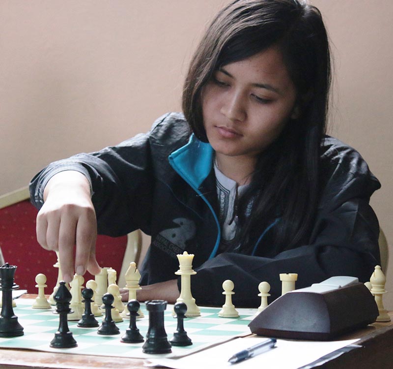 Sabina Shrestha makes her move during the second round match of the Shivani Air fifth Kamana Sahakari Chess Tournament in Lalitpur on Monday, April 3, 2017. Photo: THT