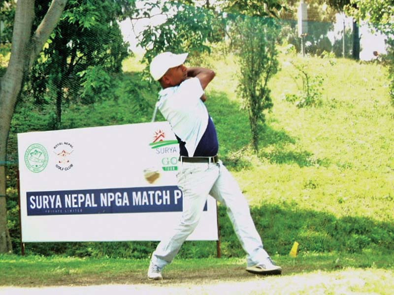 Dhana Thapa plays a shot against Ram Krishna Shrestha during their first round match of the Surya Nepal NPGA Match Play at the RNGC on Sunday. Photo Courtesy: RNGC