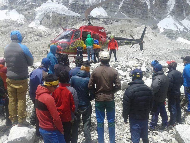 The body of famed Swiss climber Ueli Steck being loaded on a helicopter near Camp II on Mount Everest, Nepal, on April 30, 2017.
