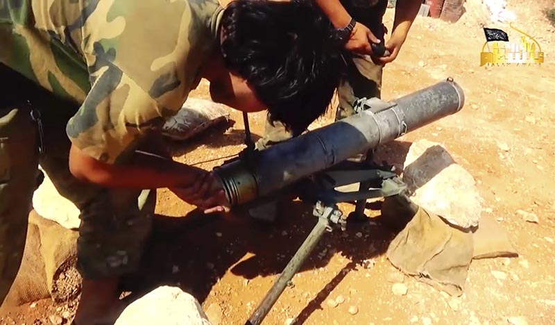 A militant website outlet that is consistent with independent AP reporting, shows A fighter from the Turkistan Islamic Party prepares to fire a missile, during a battle against the Syrian government forces, in Aleppo, Syria, in August 6, 2016. Photo: video grab from Militant Website Turkistan Islamic Party via AP