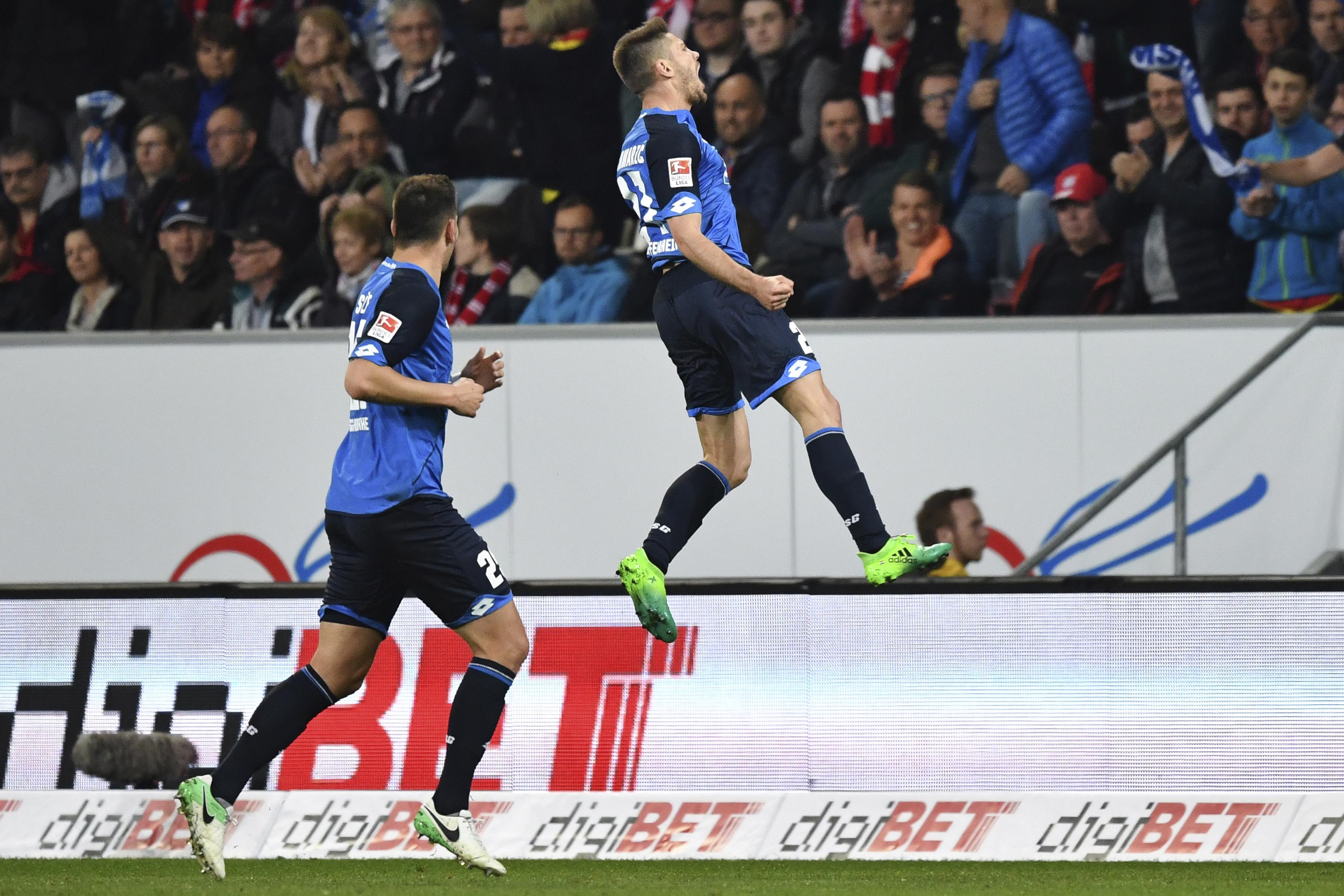 Hoffenheim's Andrej Kramaric (right), celebrates scoring the opening goal of the game against Nayern Munich during the German Bundesliga soccer match between 1899 Hoffenheim and Bayern Munich in the Rhein-Neckar-Arena in Sinsheim, Germany, on Tuesday April 4, 2017. Photo: AP