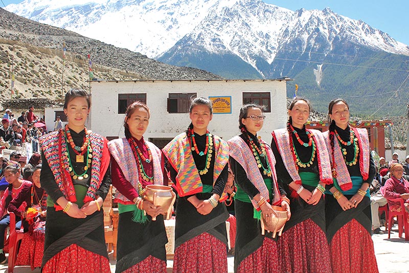 Women clad in their traditional Thakali attires welcome tourists on the occasion of 12 year festival in Gharpojhang Rural Municipality in Mustang district, on Tuesday, April 11, 2017. Photo: RSS