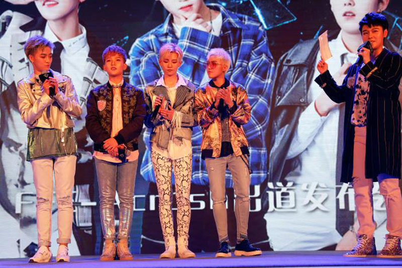 Members of China's all-girl 'boyband' FFC-Acrush appear on the stage during their maiden press conference in Beijing, China, on April 28, 2017. Photo: Reuters