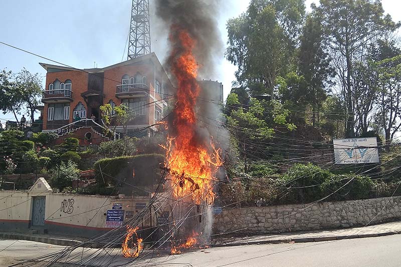 A utility pole catches fire in a junction near New Plaza, Kathmandu, on Saturday, April 8, 2017. Photo: THT