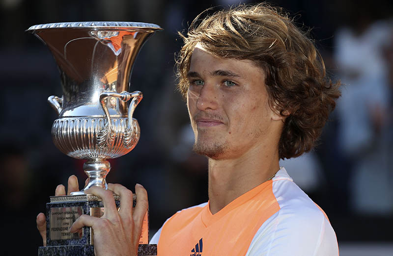 Zverev holds the trophy after his victory. Photo: Reuters