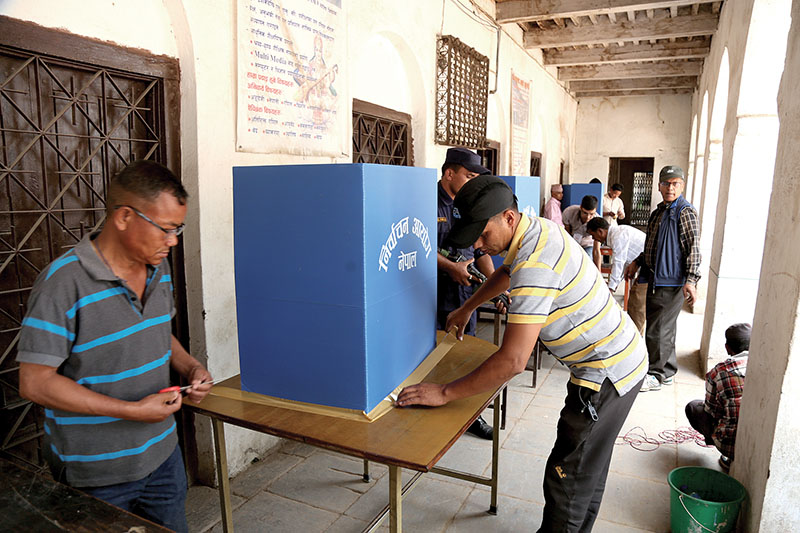 Employees setting up ballot boxes on the eve of civic polls, in Kathmandu, on Saturday, May 13, 2017. Photo: RSS